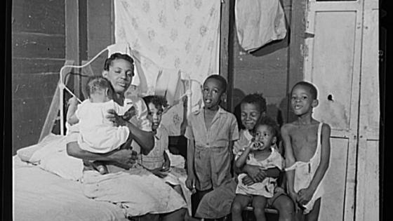 Black family in a hospital room in the 1920s