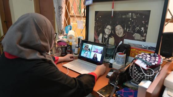 Woman on Zoom call with family