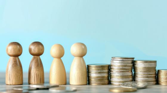 Stacks of coins and wooden figures