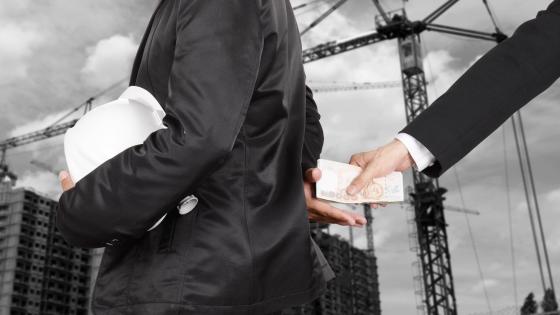 Man taking bribe for construction job