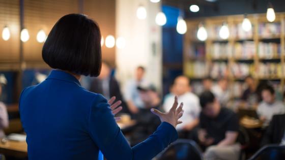 Woman Presenting to Audience