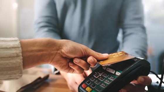 Person paying with credit card in shop