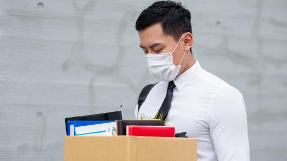 Man leaving job wearing mask