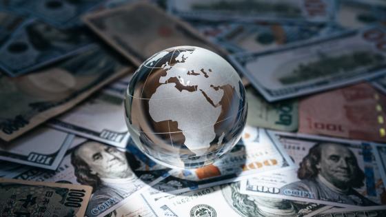 Glass globe on various currencies