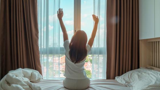 Woman stretching after waking up