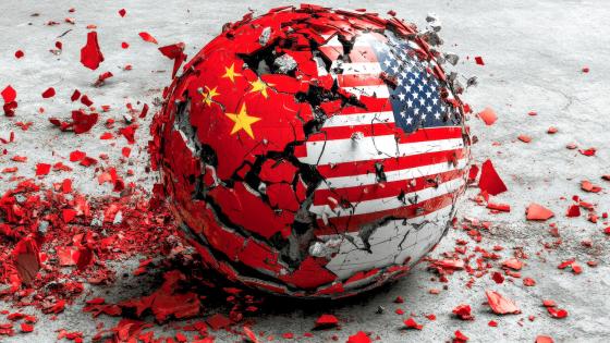 Shattered concrete ball decorated with US and Chinese flags