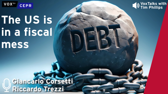 A large stone labeled "DEBT" is bound by chains, with the text "The US is in a fiscal mess" and "VoxTalks with Tim Phillips." 